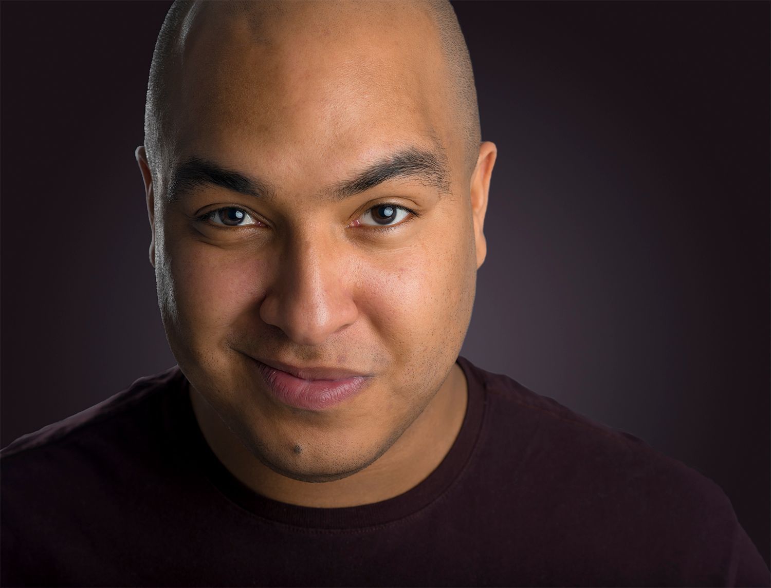 hansom young black actor with purple background