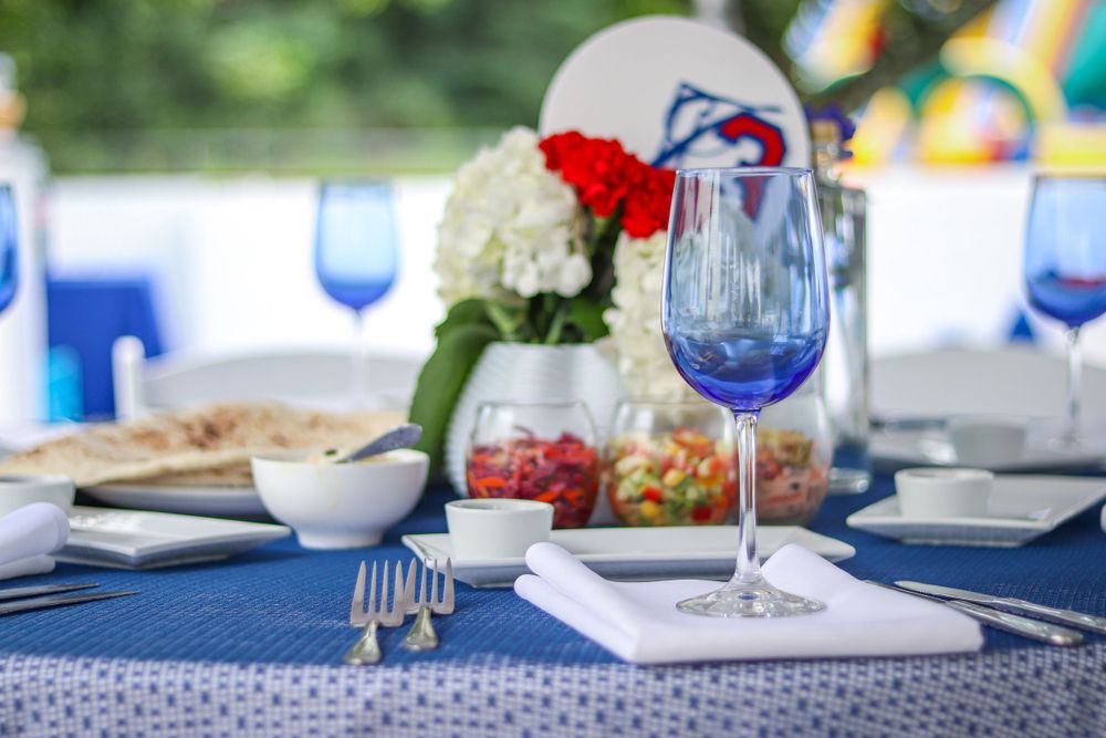 A blue-themed outdoor Bar Mitzvah tablescape
