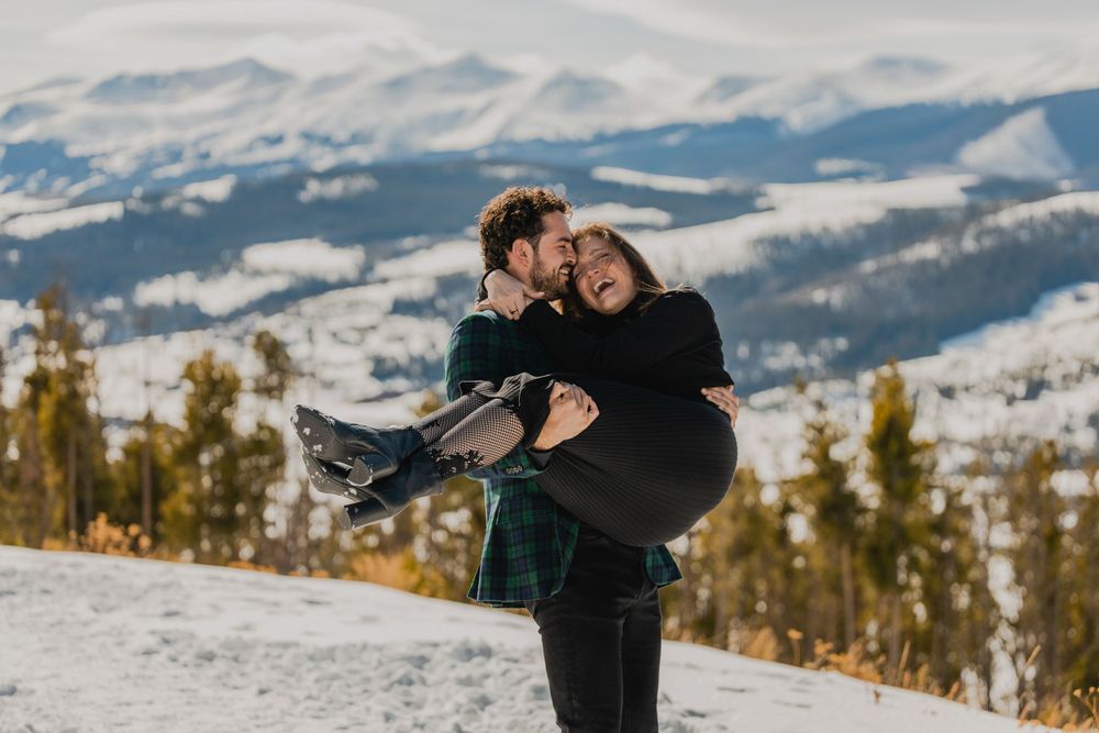 A loving embrace during the engagement photoshoot at Sapphire Point, Colorado