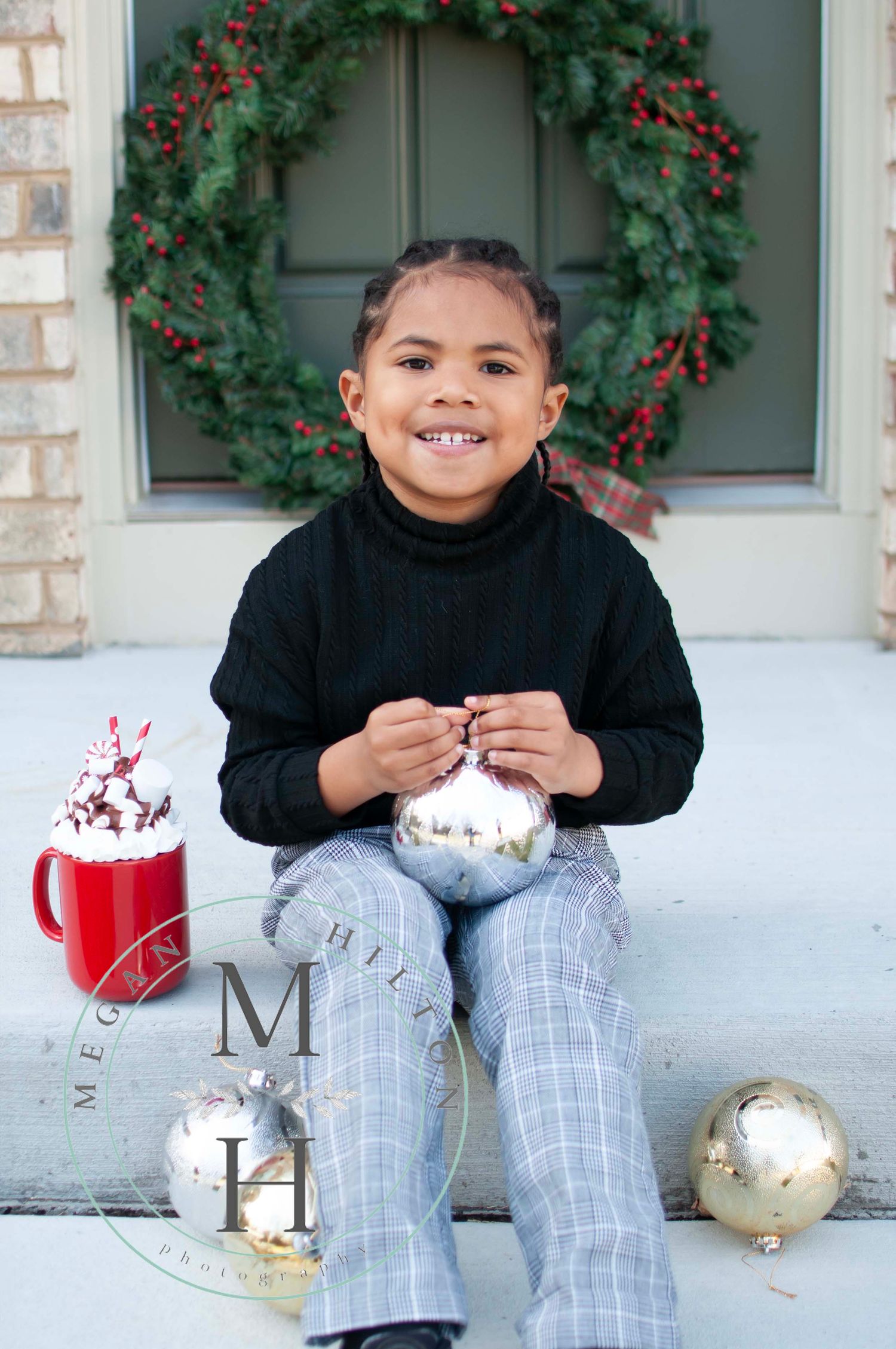 Young boy sitting on steps holiday photo