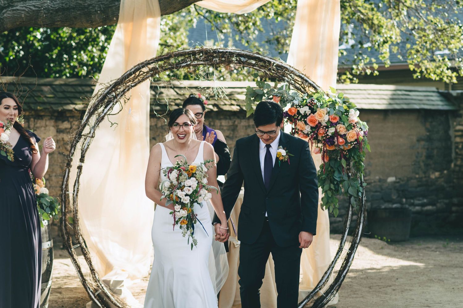 bride and groom exiting the ceremony as husband and wife in Monterey
