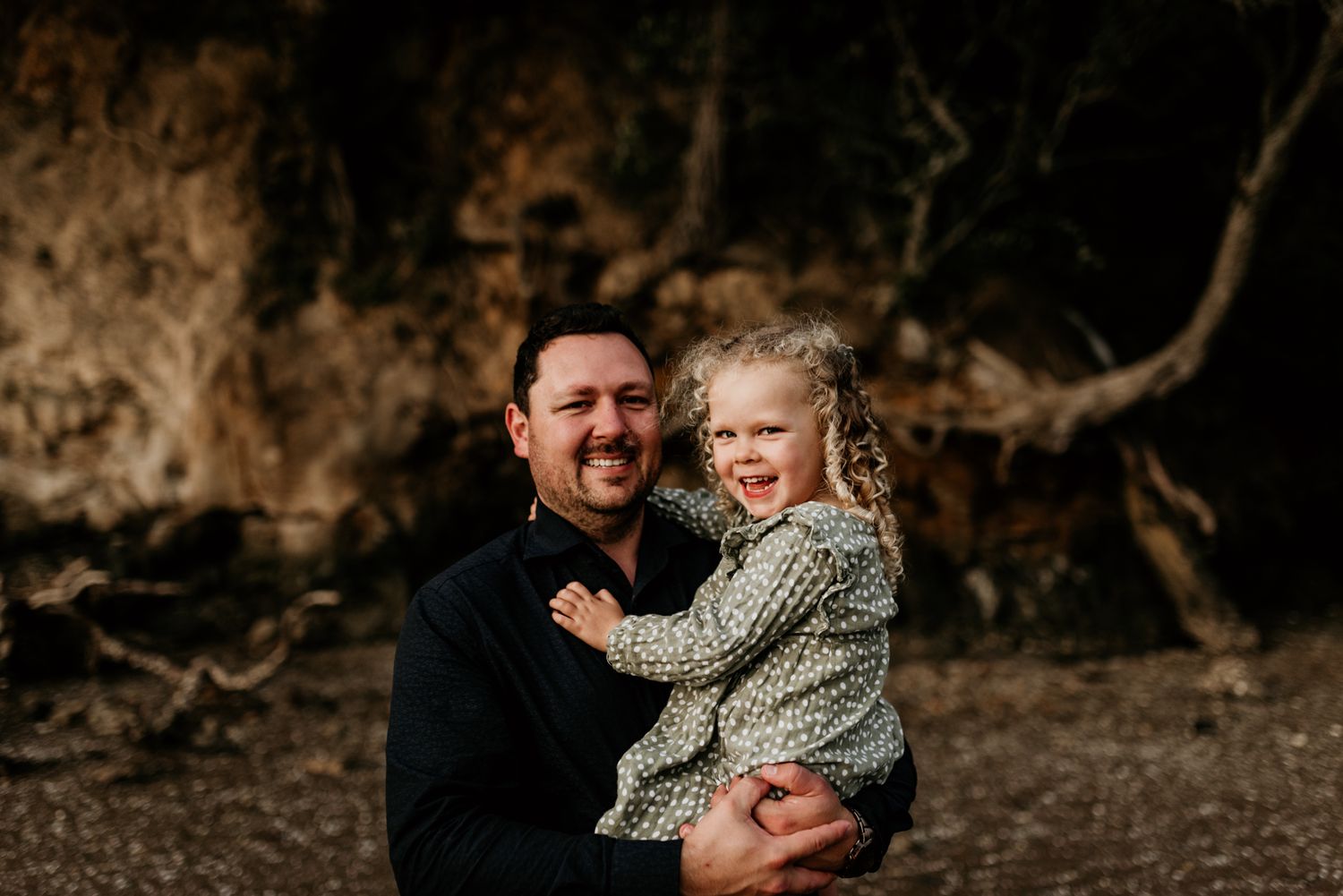 Sweet moment captured between adult and child during outdoor photo session.