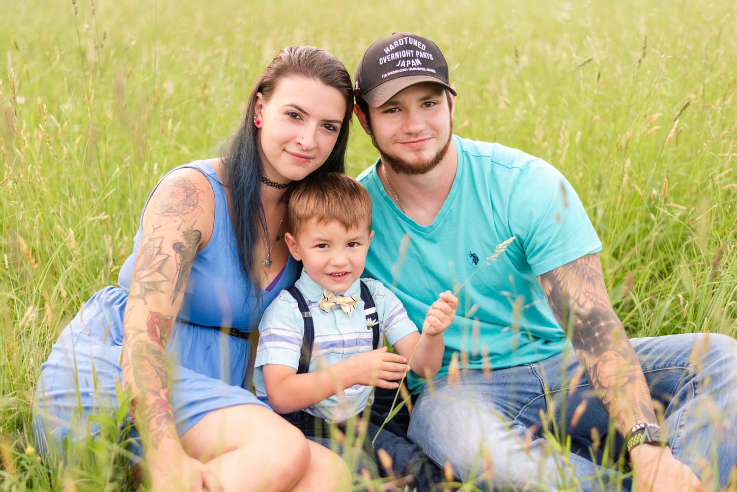 Family sitting in field in Clarion Pennsylvania