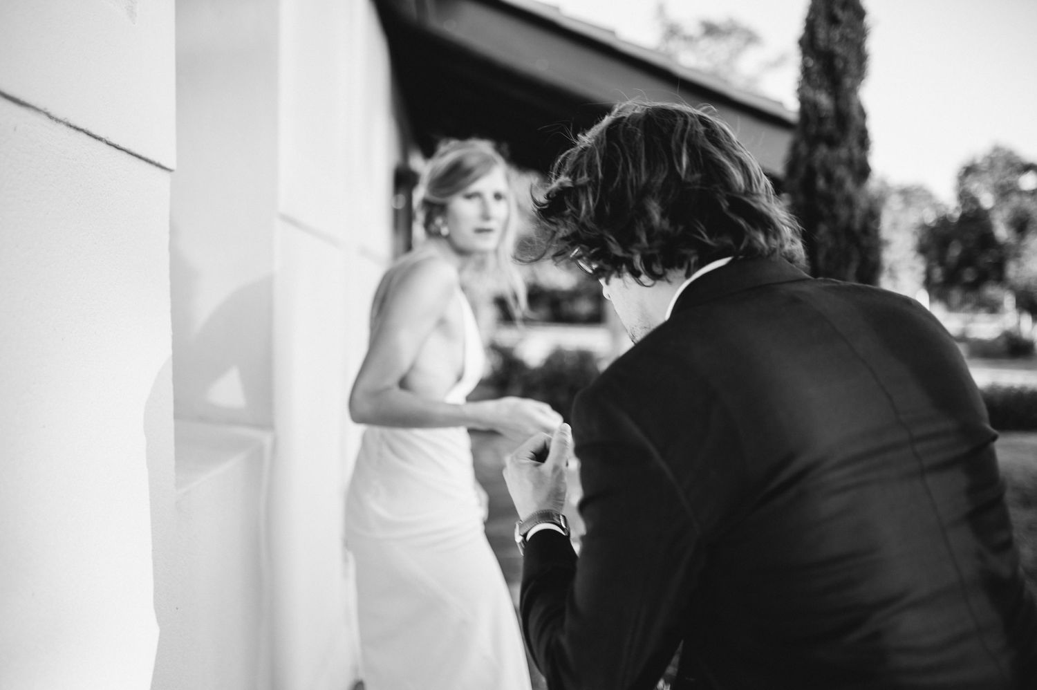 Black and white wedding celebration scene with formal attire.