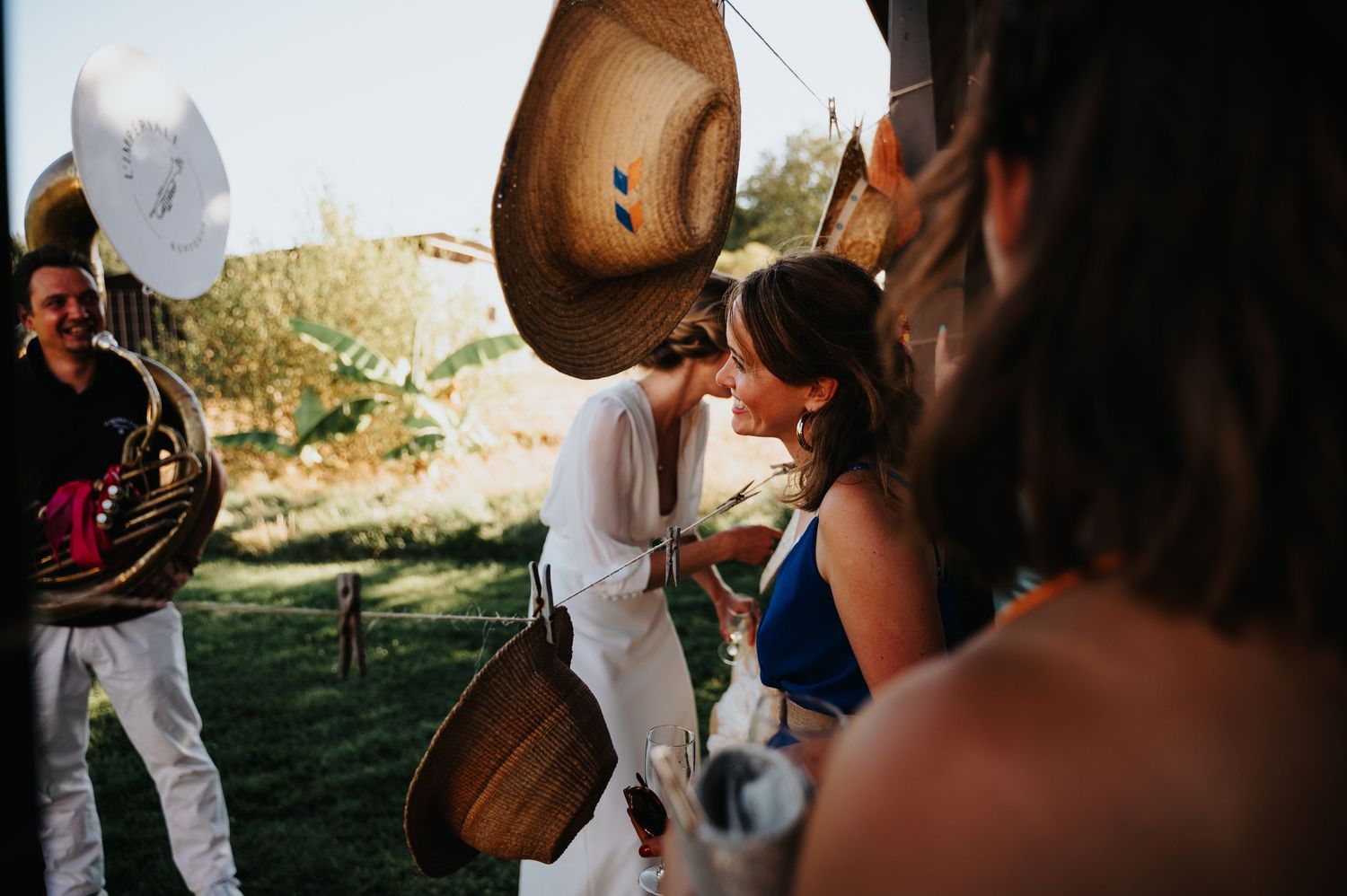 Musicians perform live music at an outdoor wedding celebration.