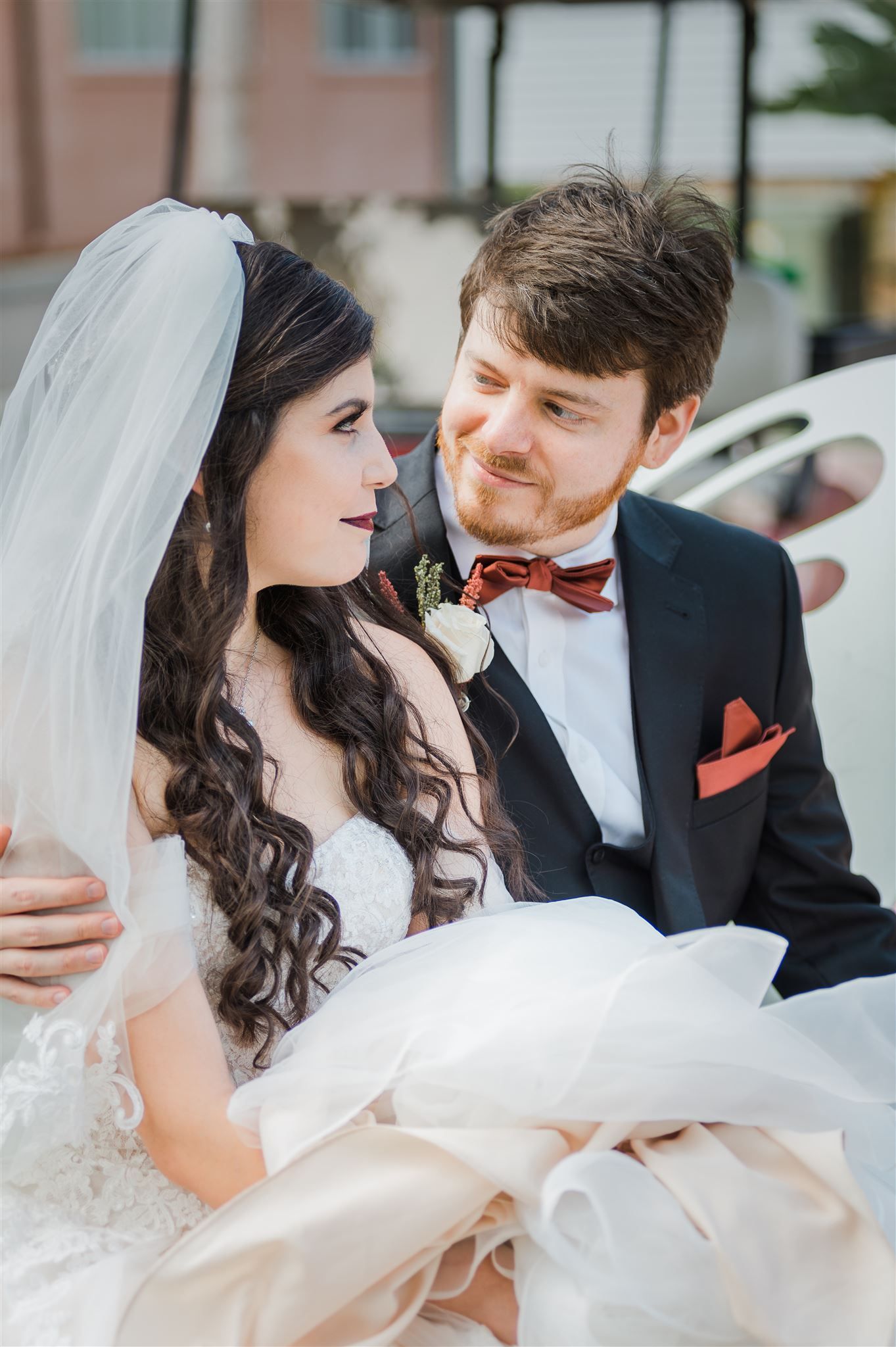 Newlywed couple sharing intimate moment after wedding ceremony.