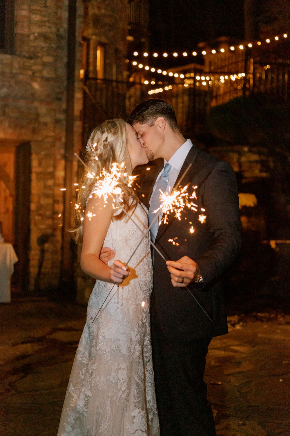 Couple holding sparklers and kissing at night North GA Elopement Captured Shooting for Brianna Marie Photography