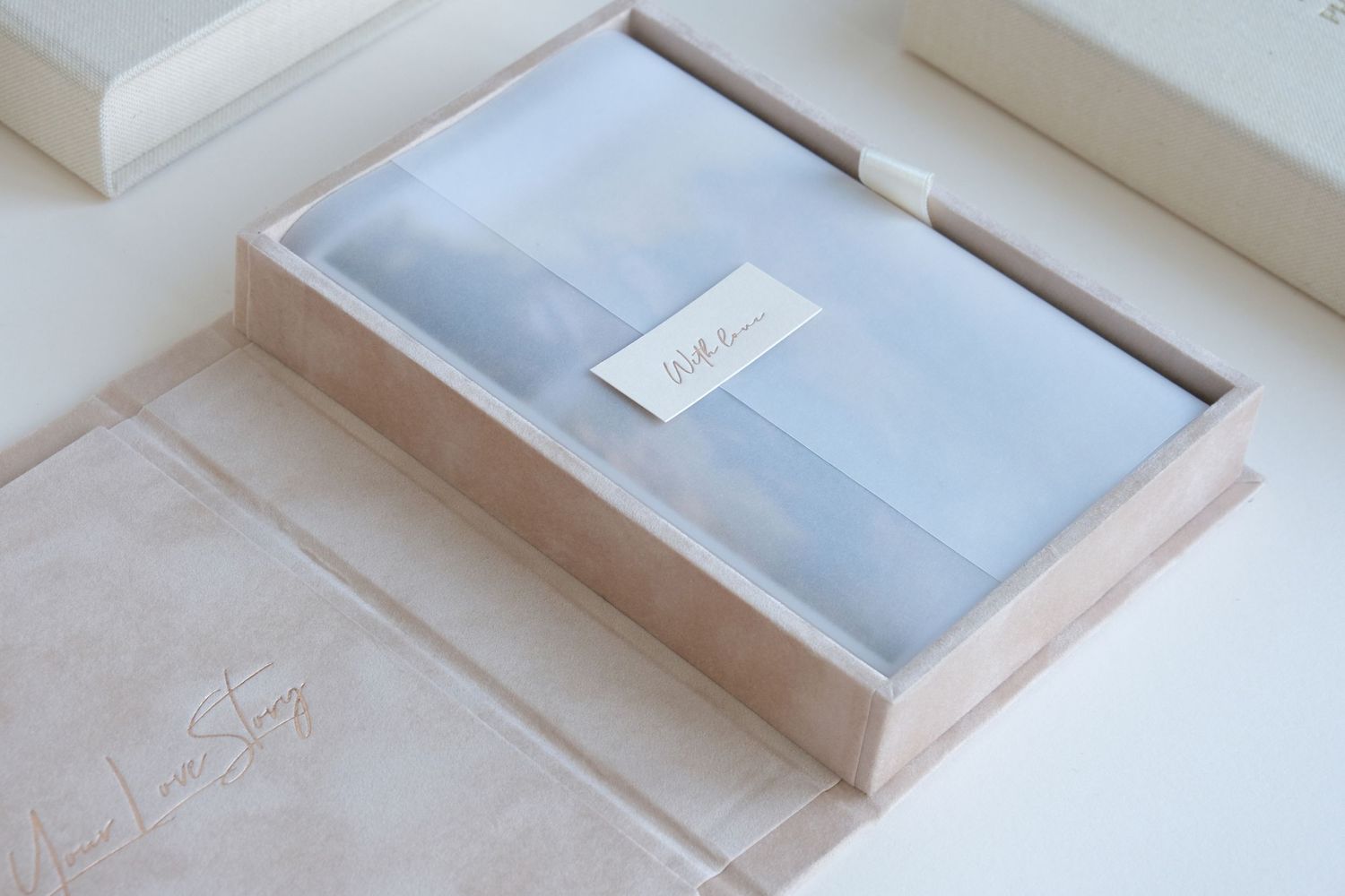 Clean minimalist white storage boxes with soft blue accents displayed in sequence.