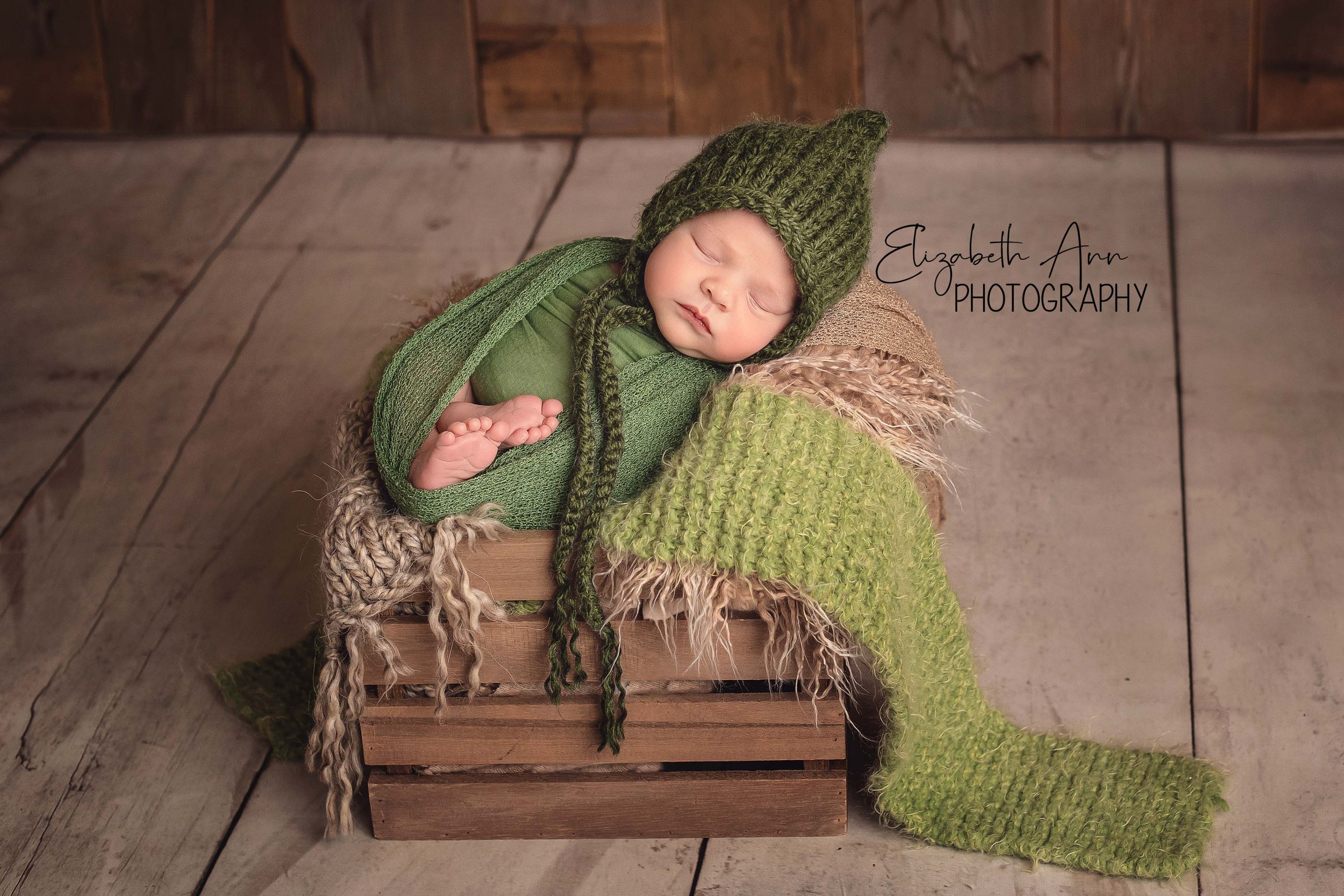 Rustic newborn portrait, baby is swaddled in green with barnwood, by Elizabeth Ann Photography, Wisconsin, USA