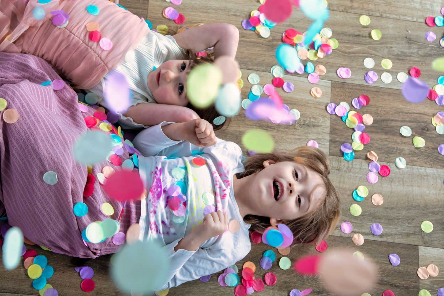 girls playing in confetti at Jackie Phairow Photography