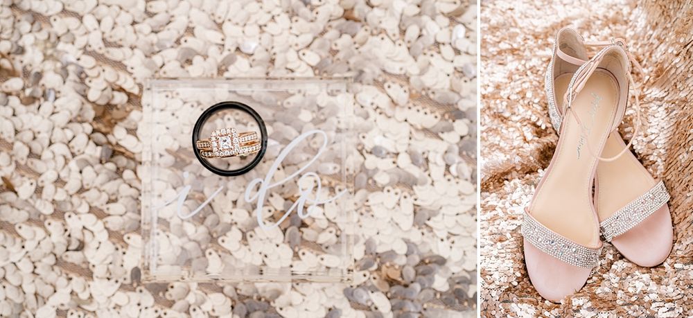 Wedding details featuring rings and blush pink shoes against a lace background.