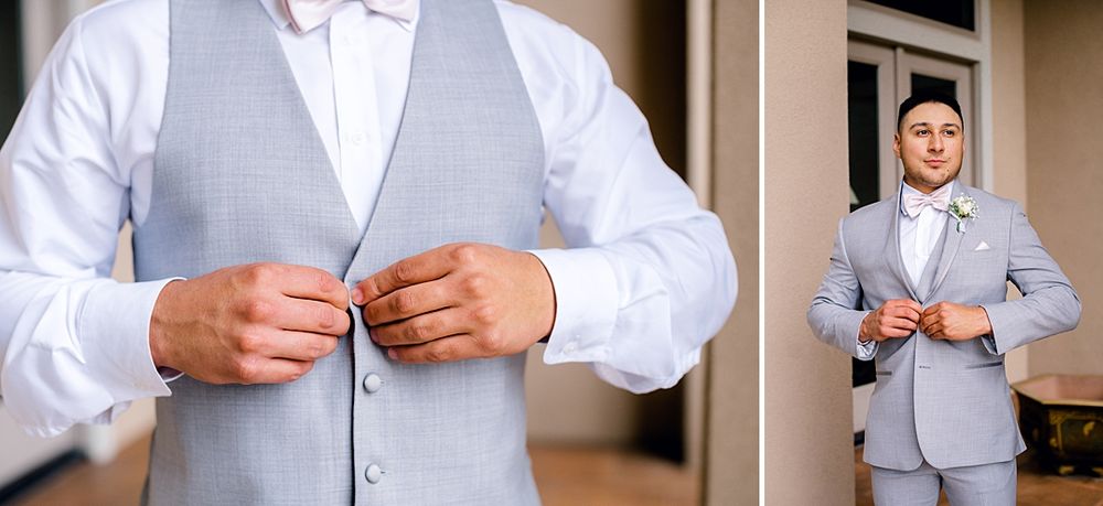 Groom's formal attire details showing light grey vest and white bow tie.