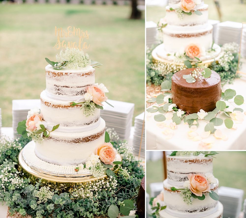 Semi-naked wedding cake decorated with fresh peach roses and eucalyptus greenery.