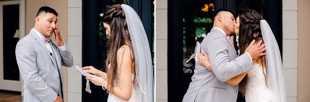 A first look wedding moment between a couple with emotional reactions in a grey suit and white dress.