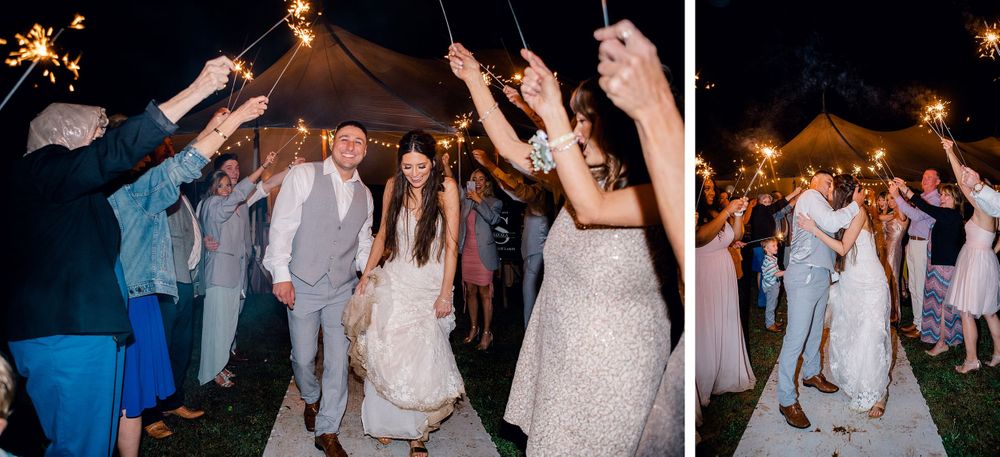 Wedding celebration with guests holding sparklers creating a magical nighttime exit for the newlyweds.