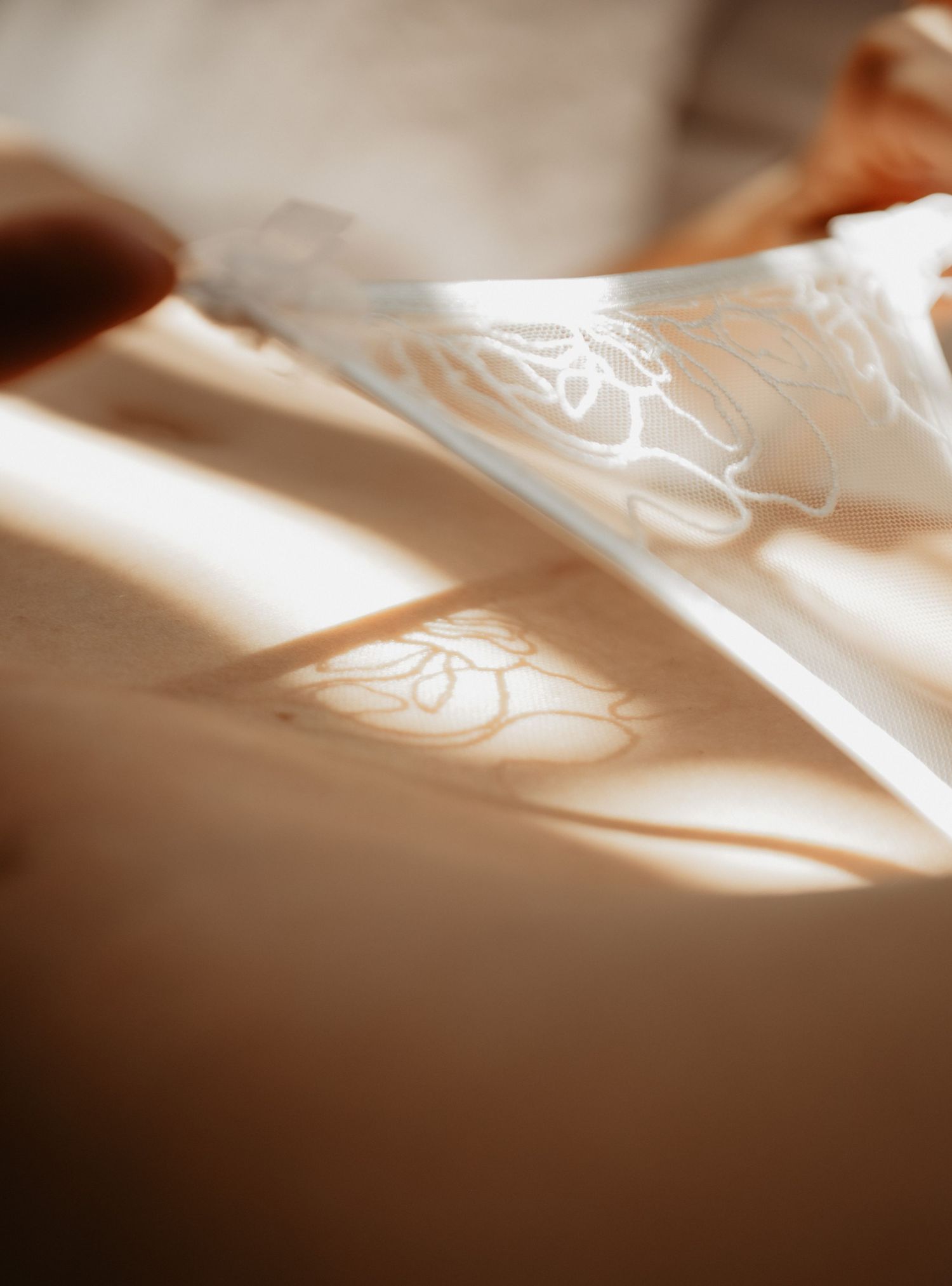 Woman photographed in lingerie during an indoor boudoir session in Utah