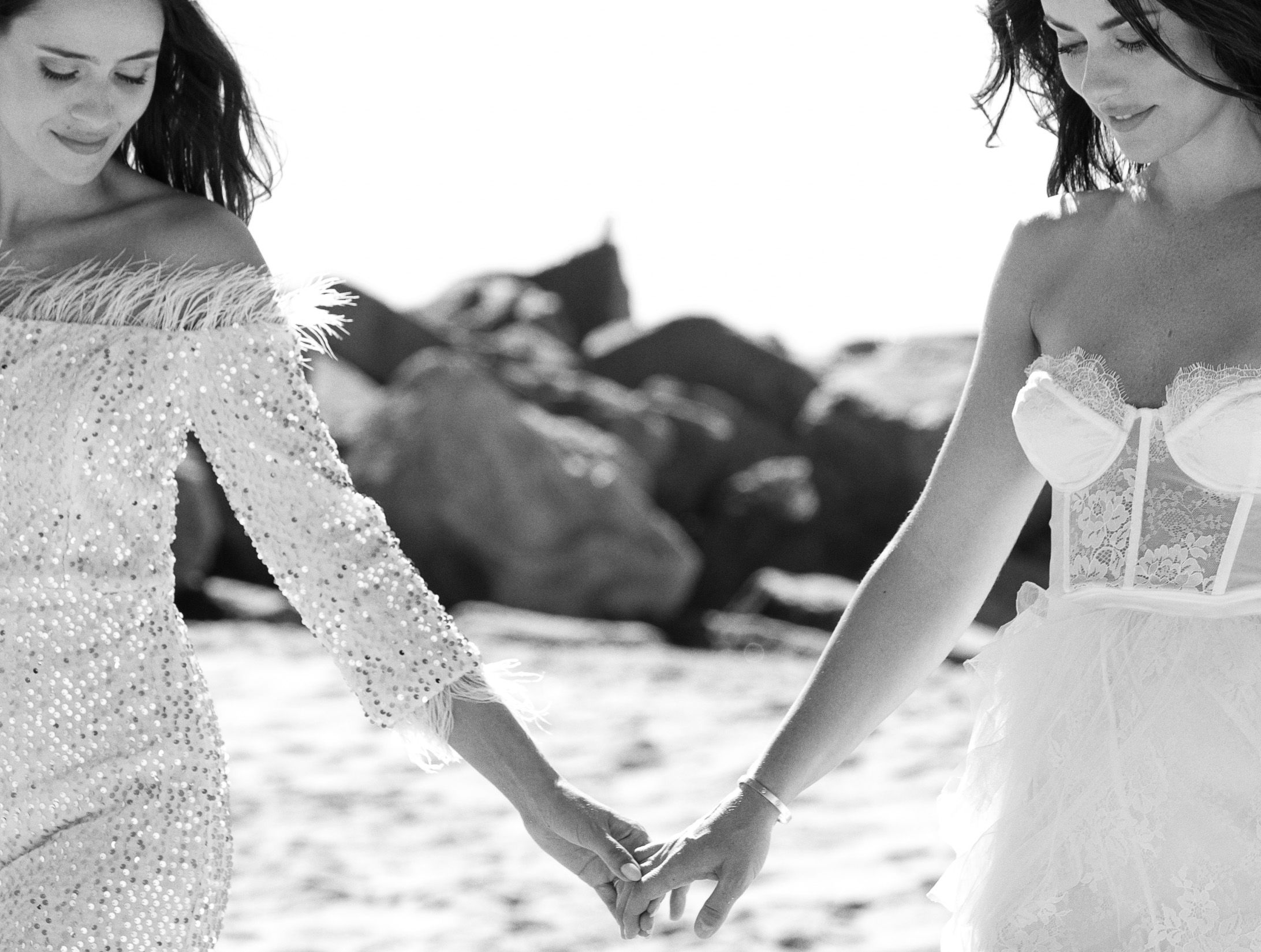A romantic beach wedding collection showing close-up details of white dresses, rings, and gentle seaside moments.