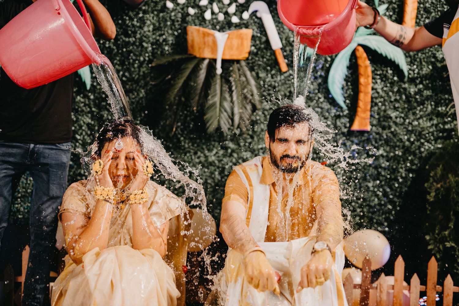 Red drinks splashing dramatically during outdoor celebration.