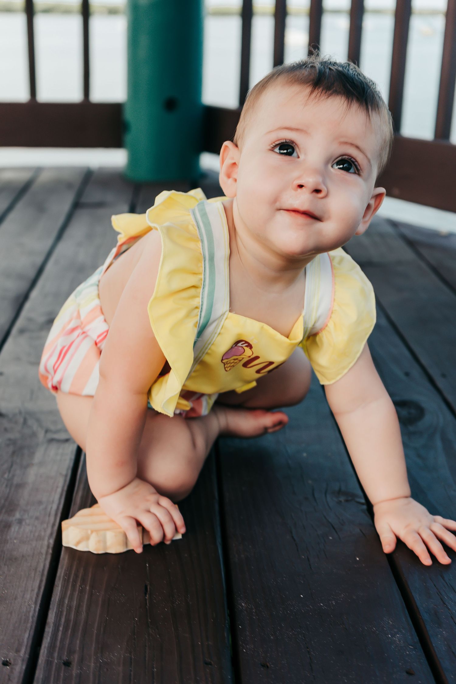 Outdoor Cake Smash Session at Maximo Park in St. Pete, FL; baby crawling toward camera