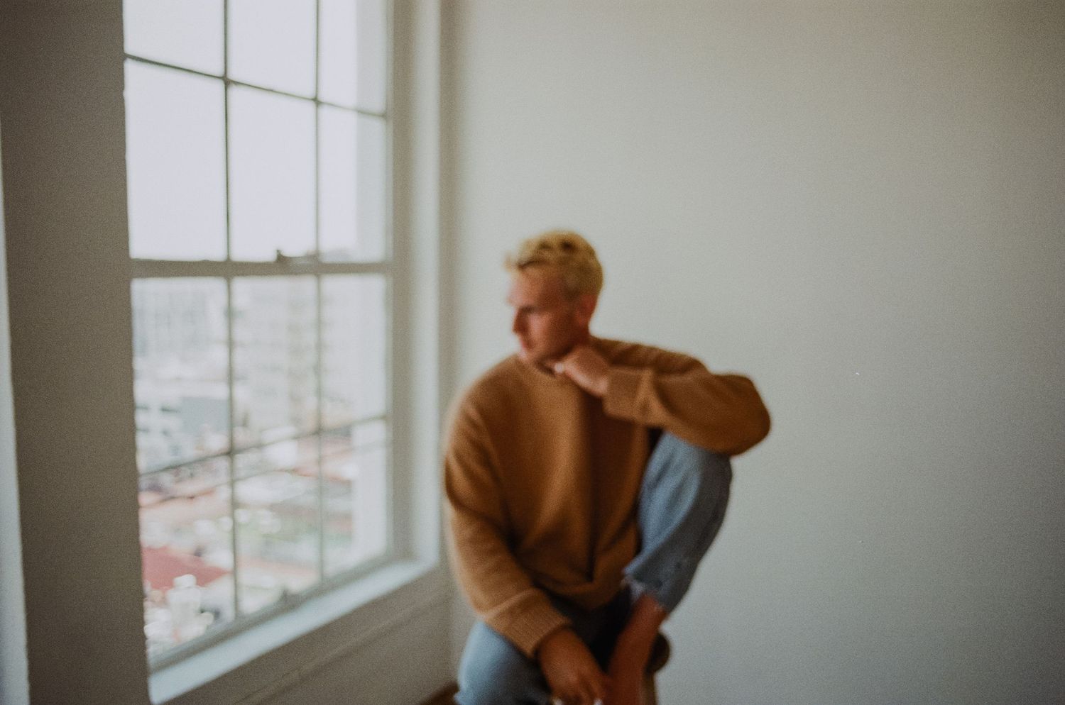 Studio brand sweater detail of man in downtown Los Angeles