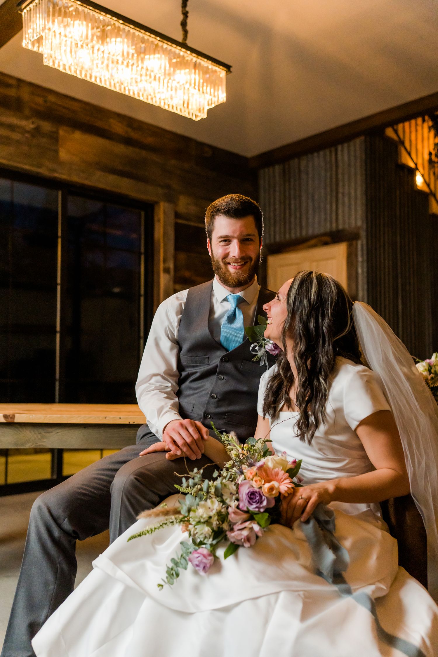bride laughs up at the groom