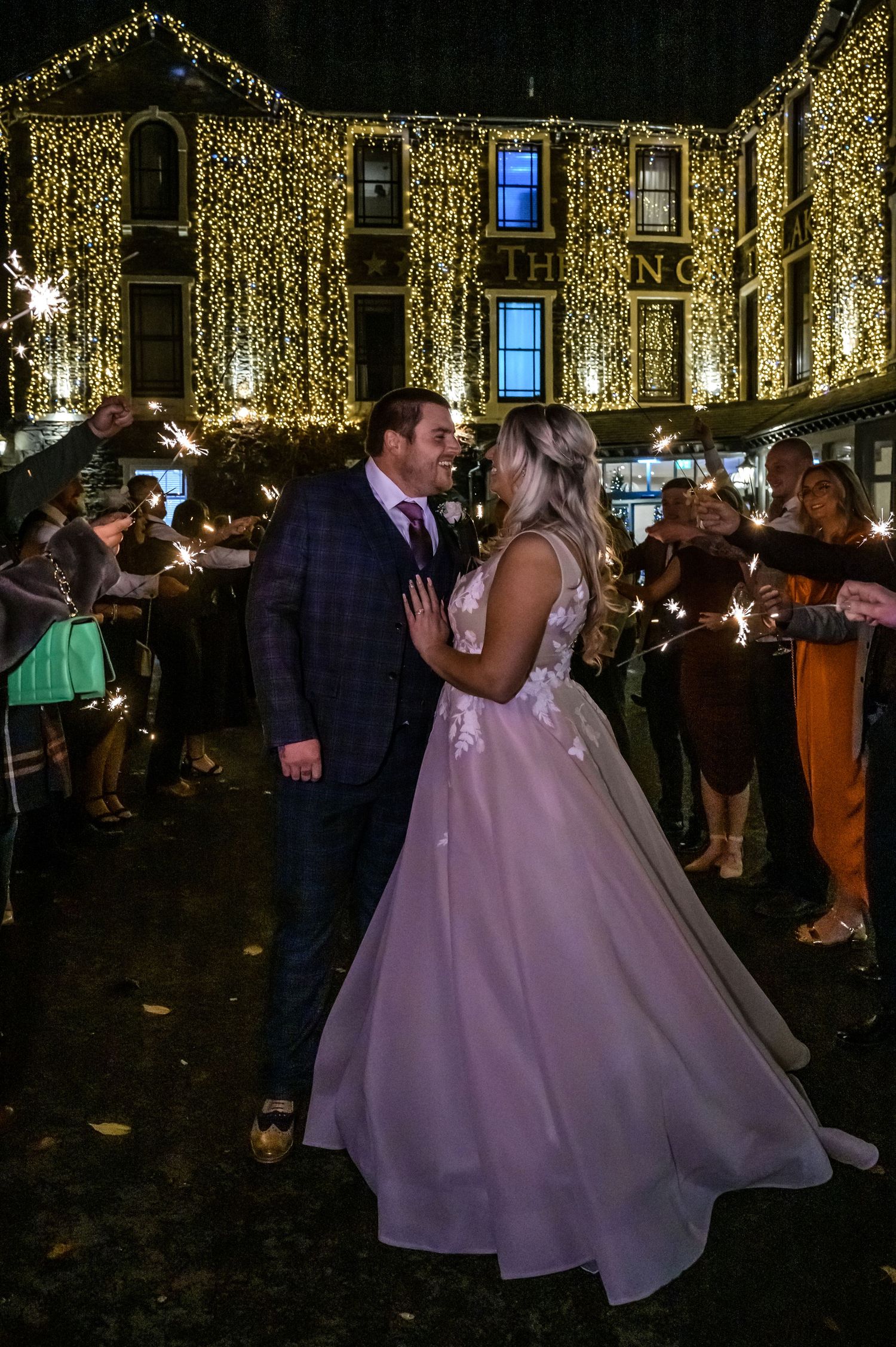 Bride and groom enjoying sparklers at Inn on the Lake