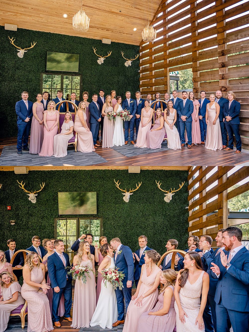 Large wedding party photo in rustic venue with moss wall and antler decor.
