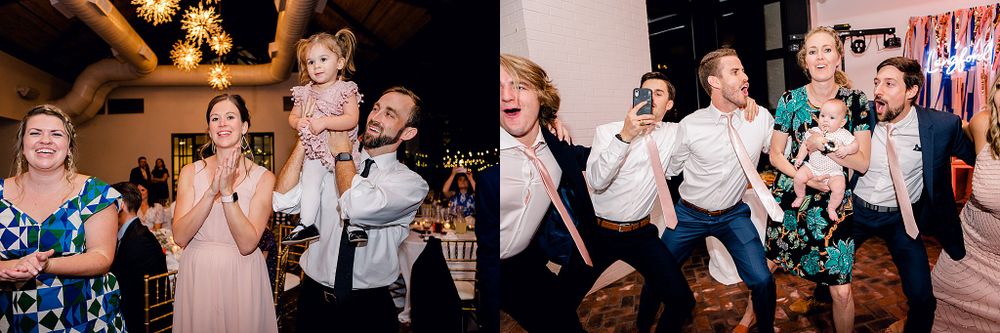 Wedding guests dancing and celebrating with high energy on dance floor.