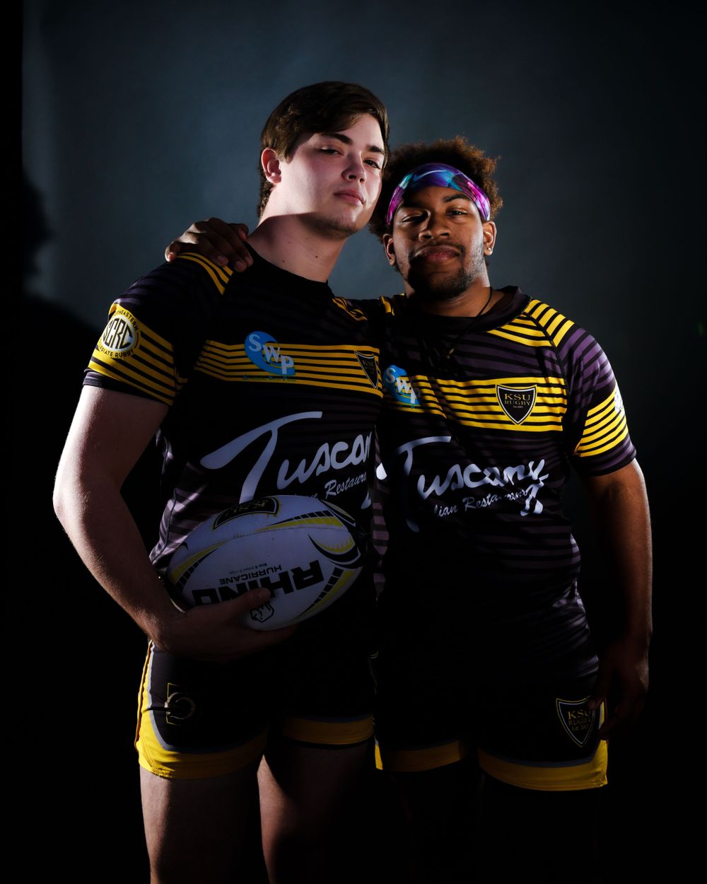Rugby team members showcase uniforms and equipment in moody studio portraits.