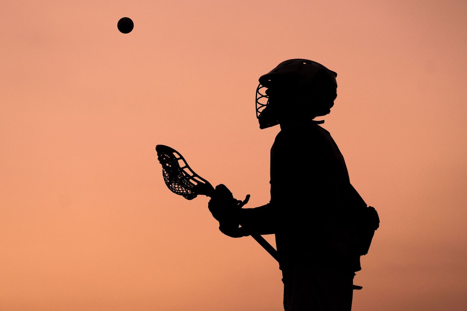 Plymouth, MA photographer Heidi Harting makes stunning sunset silhouette images of high school seniors
