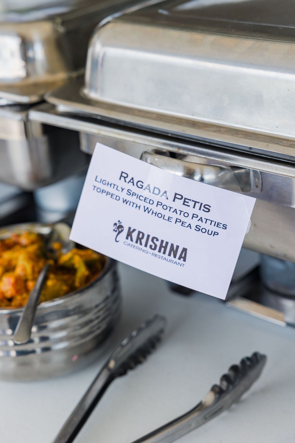 Food label for Ragada Petis Indian appetizer at catered event.