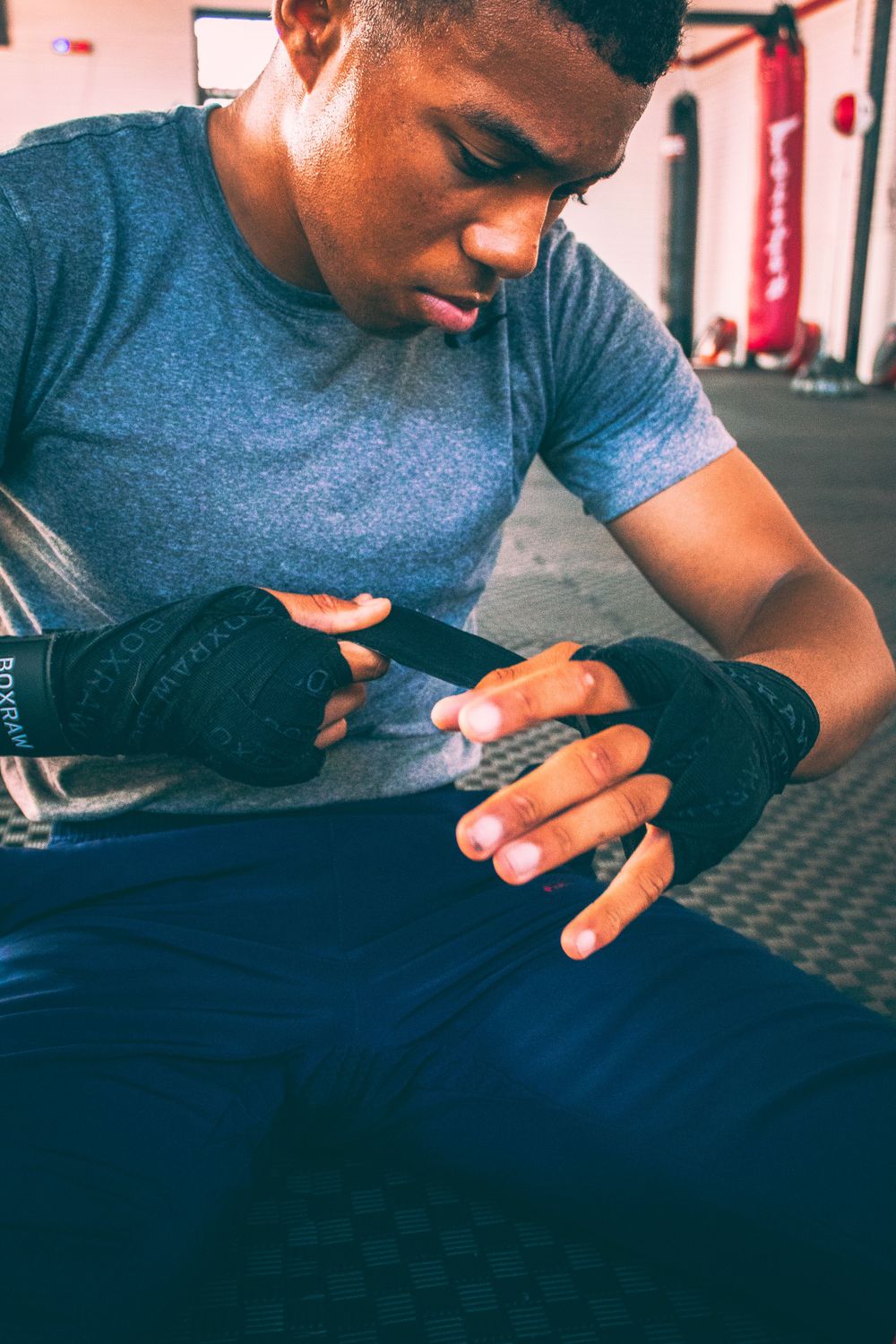 man wrapping his hands for a fight