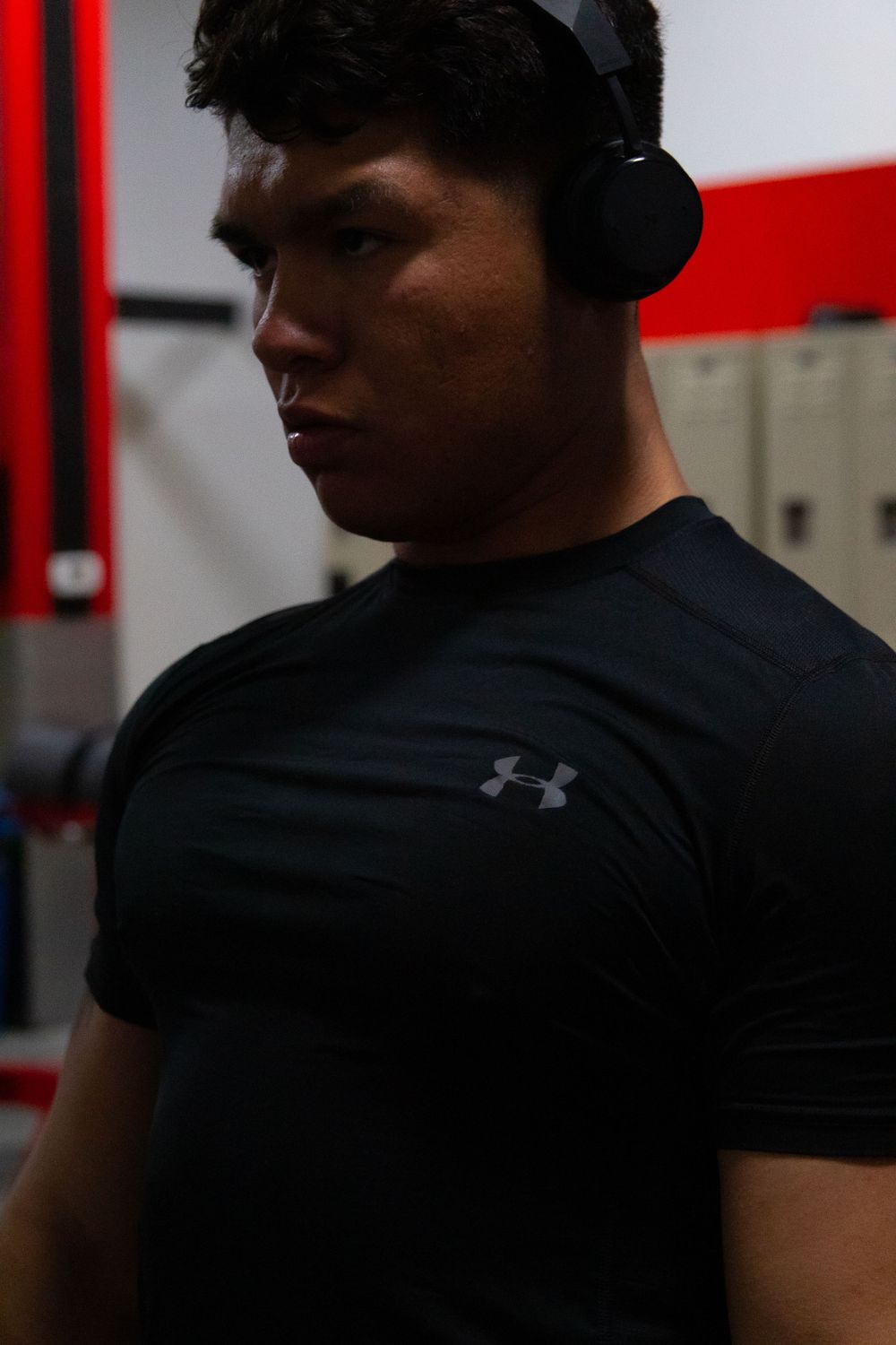 man deadlifting weights in metroflex gym in oceanside, ca