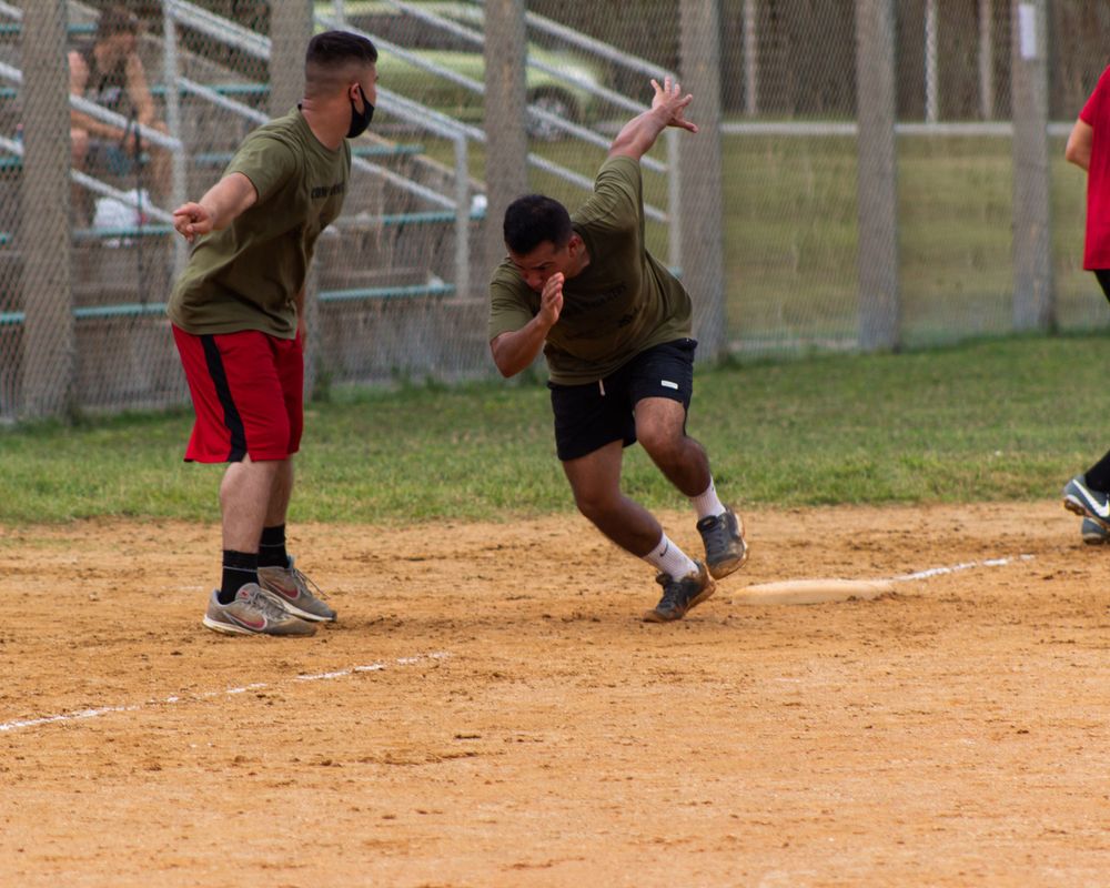 man running to base in a softball game in camp hansen, okinawa, japan