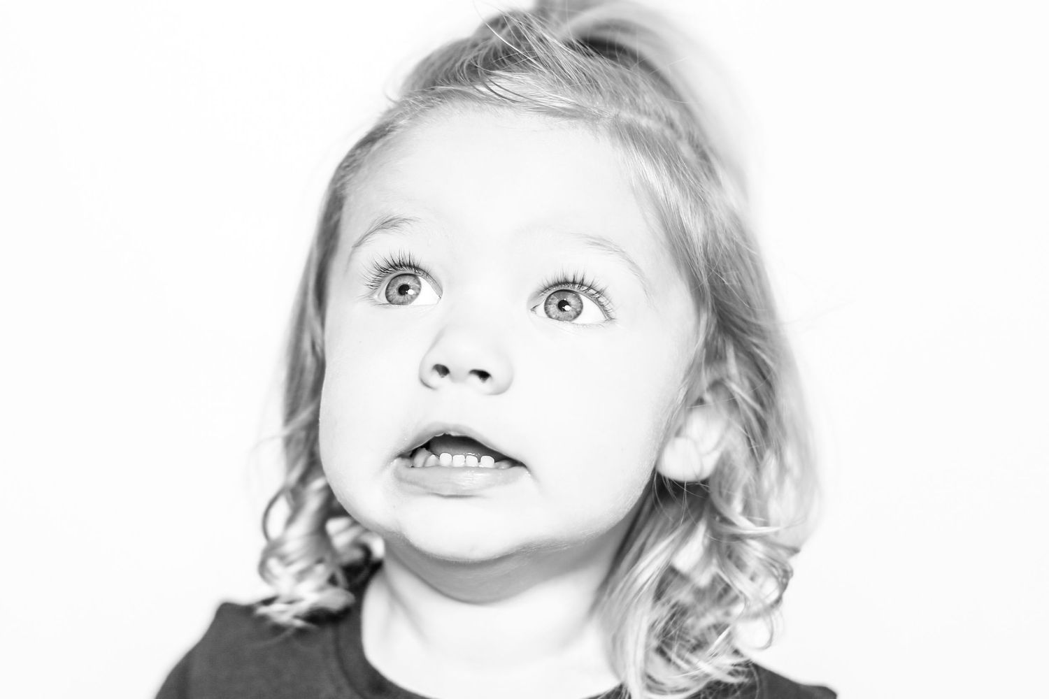 little girl looks up with confused face in portrait by Stephanie Le Shana photography