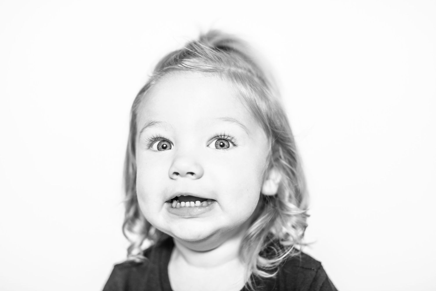 little girl has silly face in portrait by Stephanie Le Shana photography
