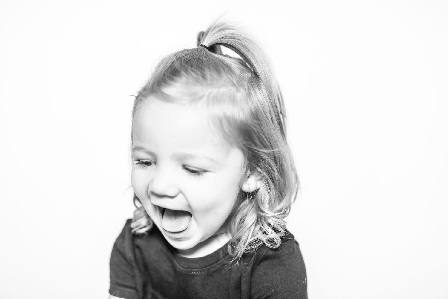 little girl laughs in portrait by Stephanie Le Shana photography