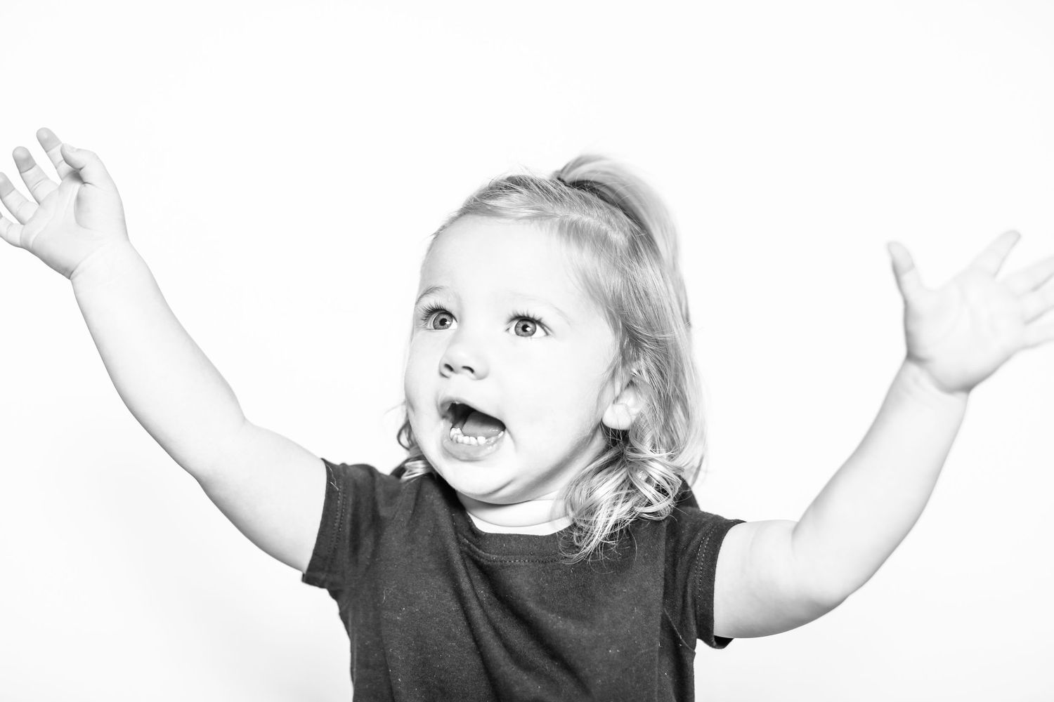 little girl has arms in the air in portrait by Stephanie Le Shana photography