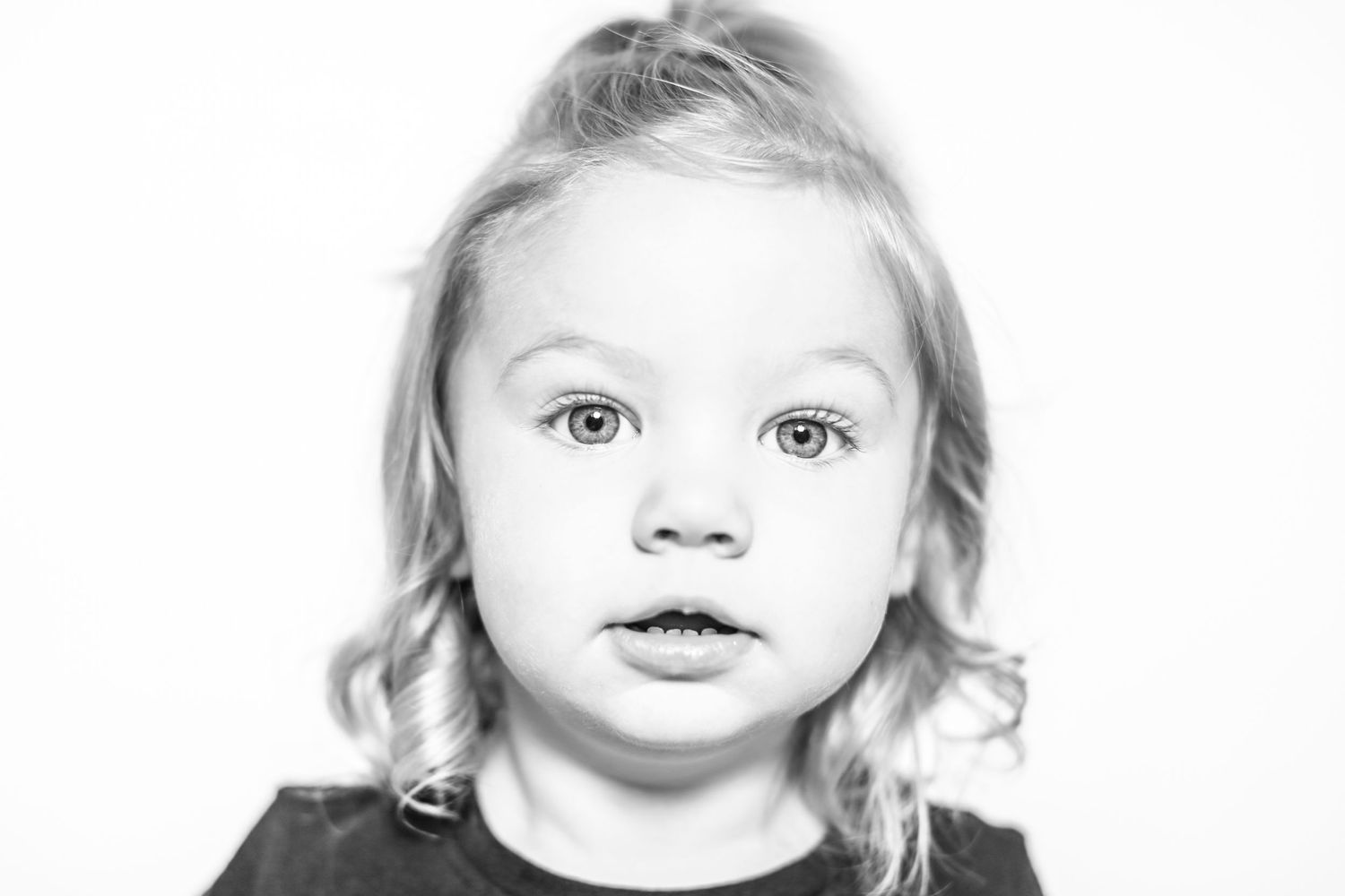 little girl looks at the camera in portrait by Stephanie Le Shana photography