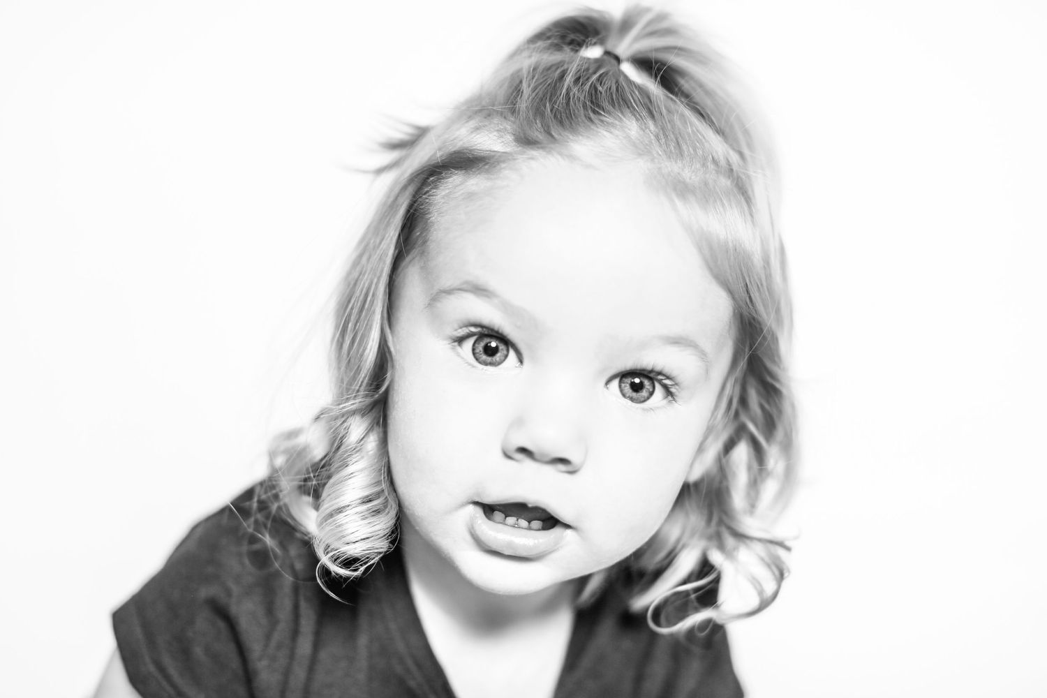 little girl looks at the camera in portrait by Stephanie Le Shana photography