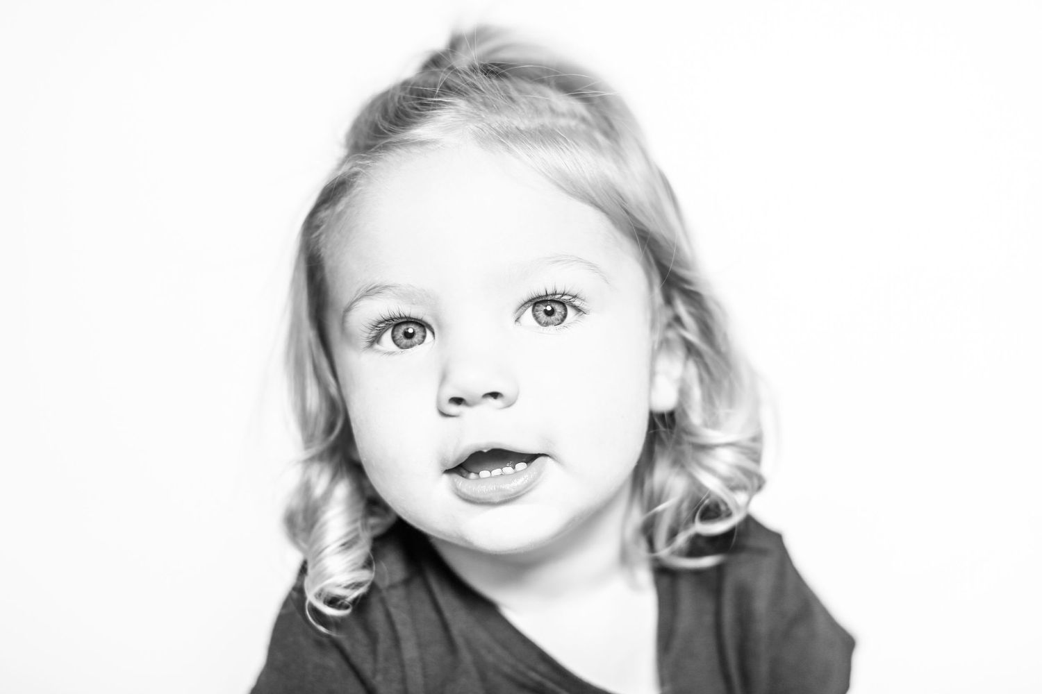 little girl looks at the camera in portrait by Stephanie Le Shana photography
