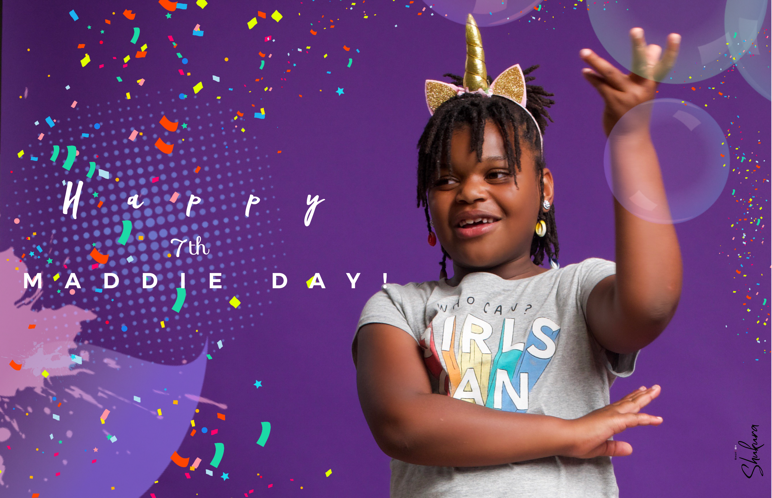 Joyful celebratory pose with confetti and unicorn headband against purple background.