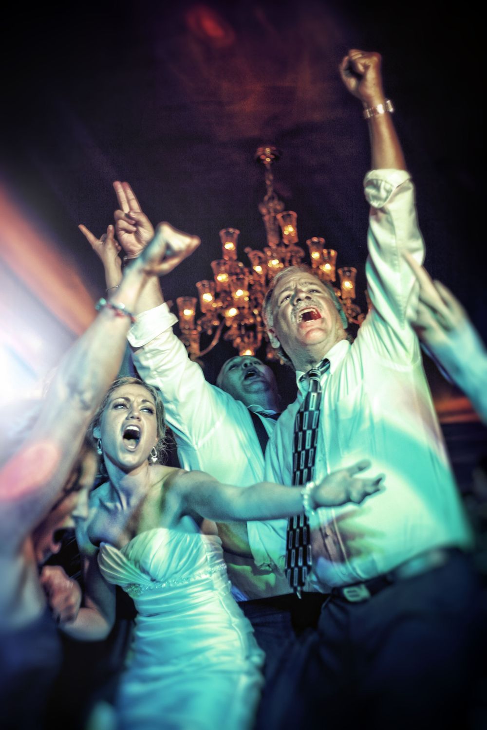 the bride and groom dancing in the crowd, in the style of demonic photograph, biblical grandeur, new american