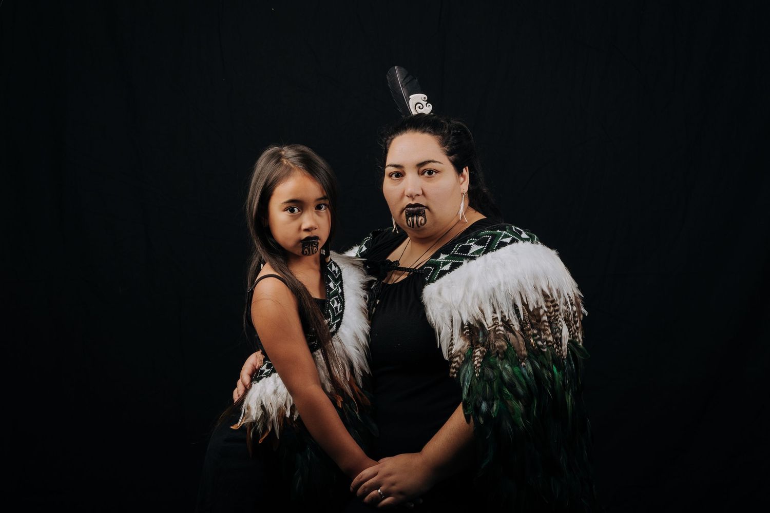 Maania Tealei and Leilani Tealei styled in cultural attire as Maori Portraits. wearing Maori kakahu. mother and child.
