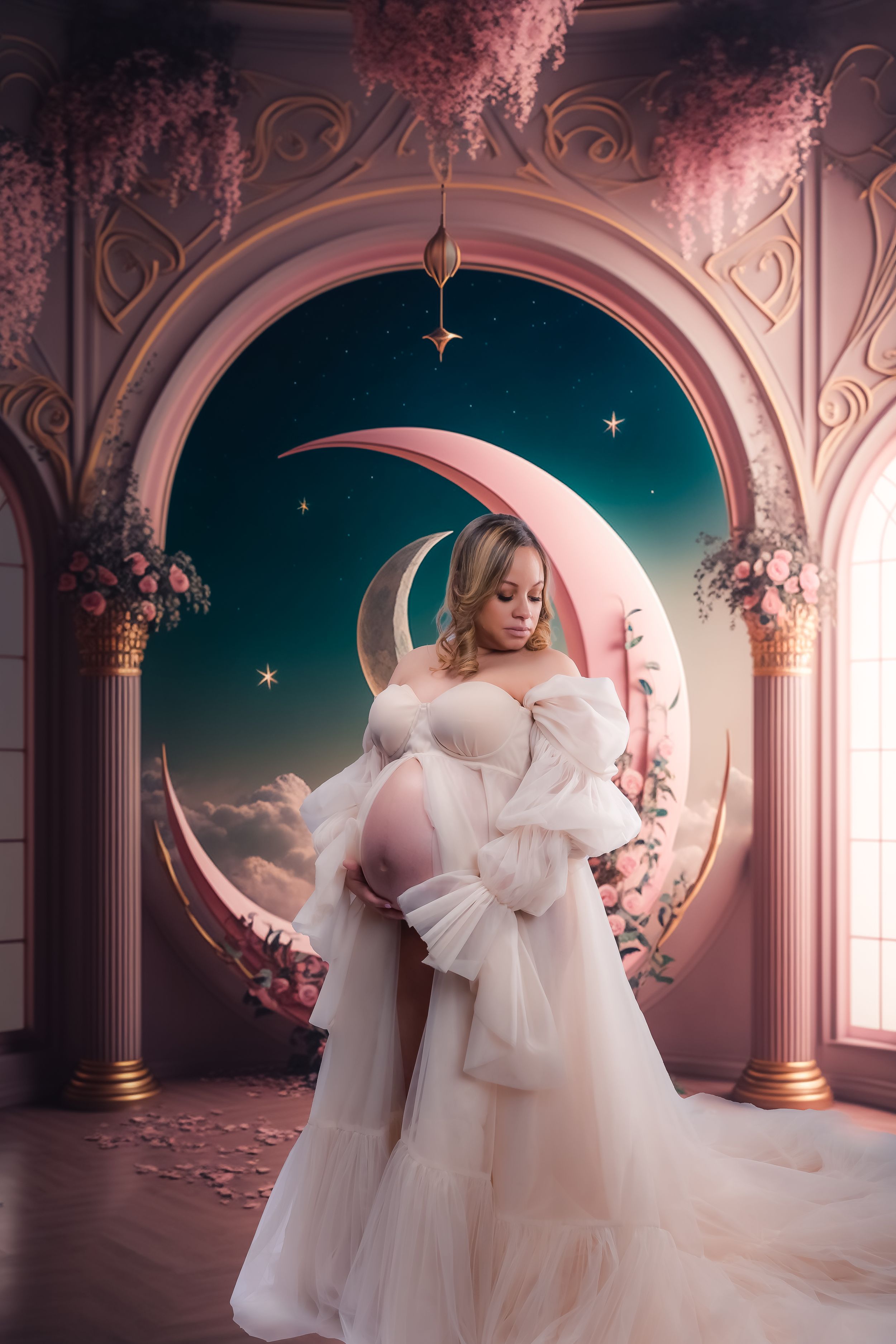 Whimsical maternity portraits in white gown with moon and stars themed palace setting.