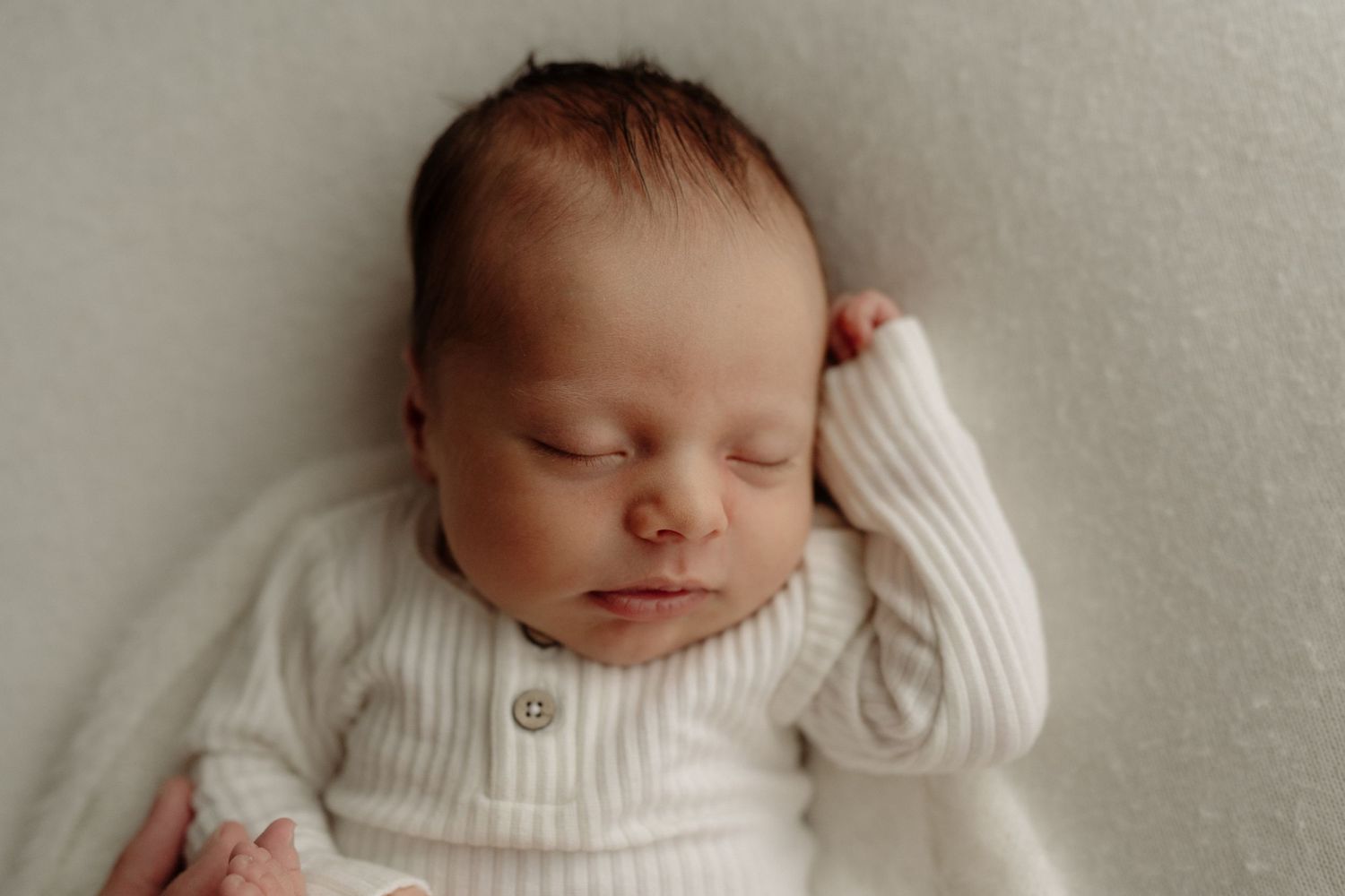 natural newborn photoshoot in home, baby lying down Auckland