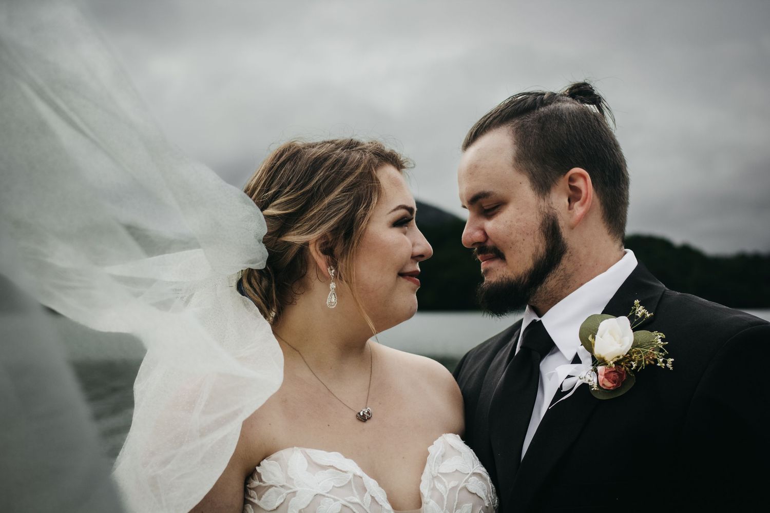 Newlywed couple gazing at each other lovingly in a wedding portrait at Carvins Cove near Roanoke, Virginia.