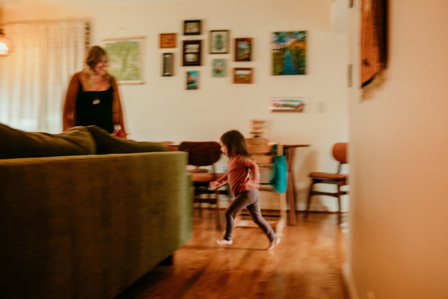 blurry image of child running through house family photography portland oregon