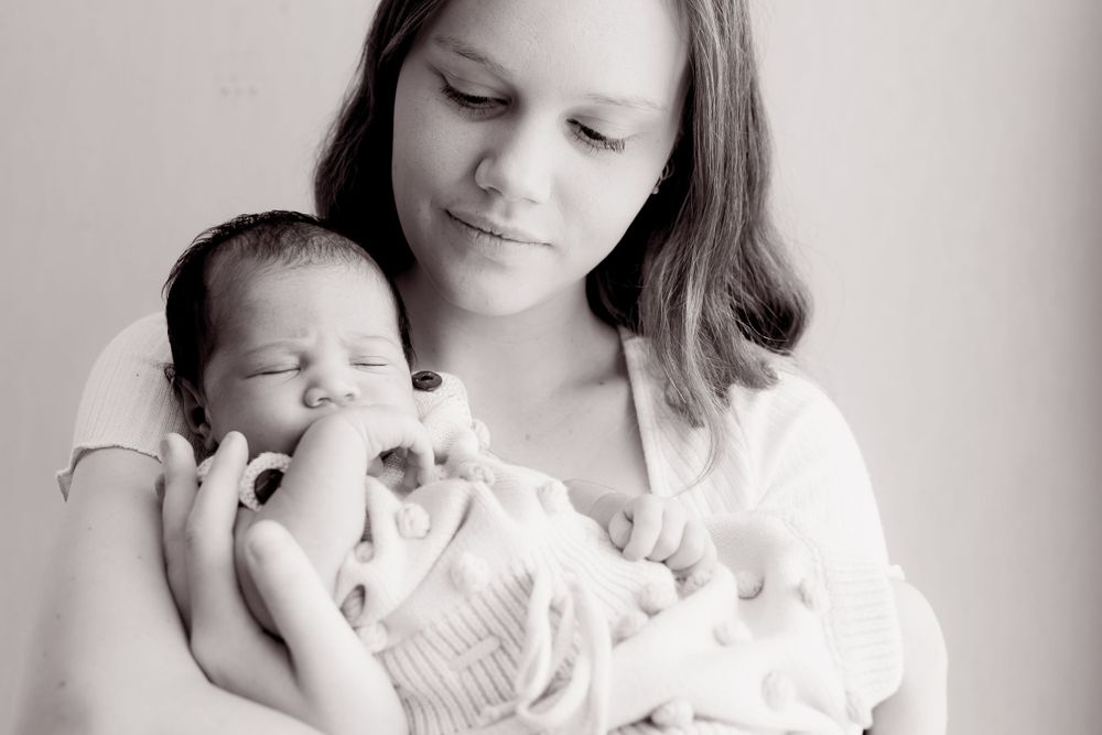 black and white photo of mum and baby