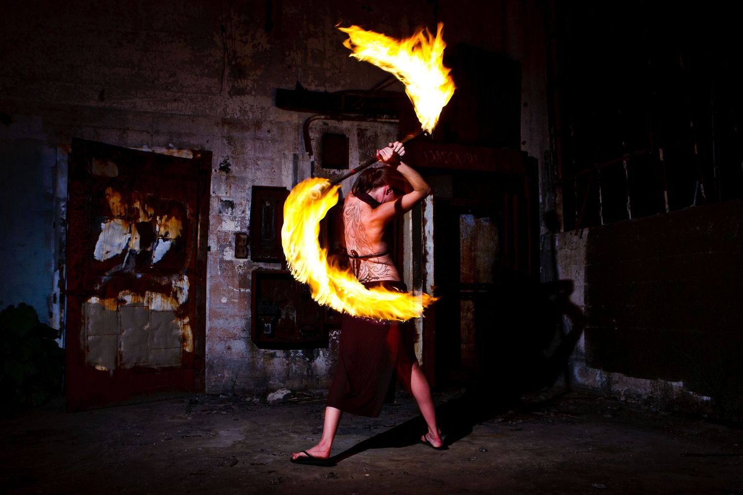 Haven Wheelock spins her fire contact staff